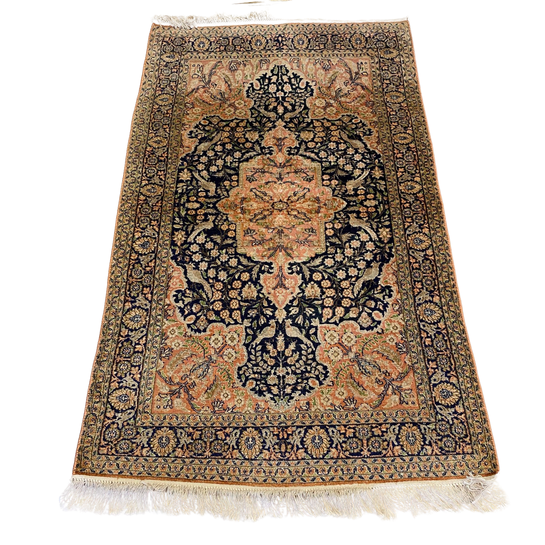 Hand knotted silk rug