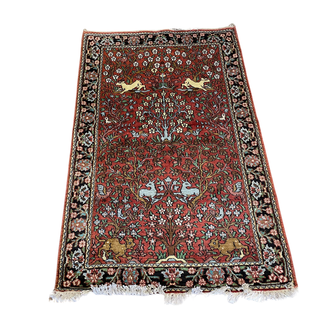 Hand knotted silk rug